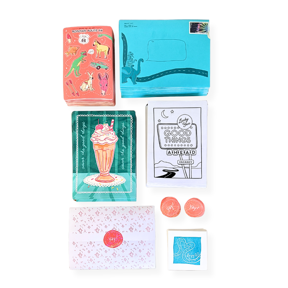 Collection of colorful mail club goodies and stickers on a white background